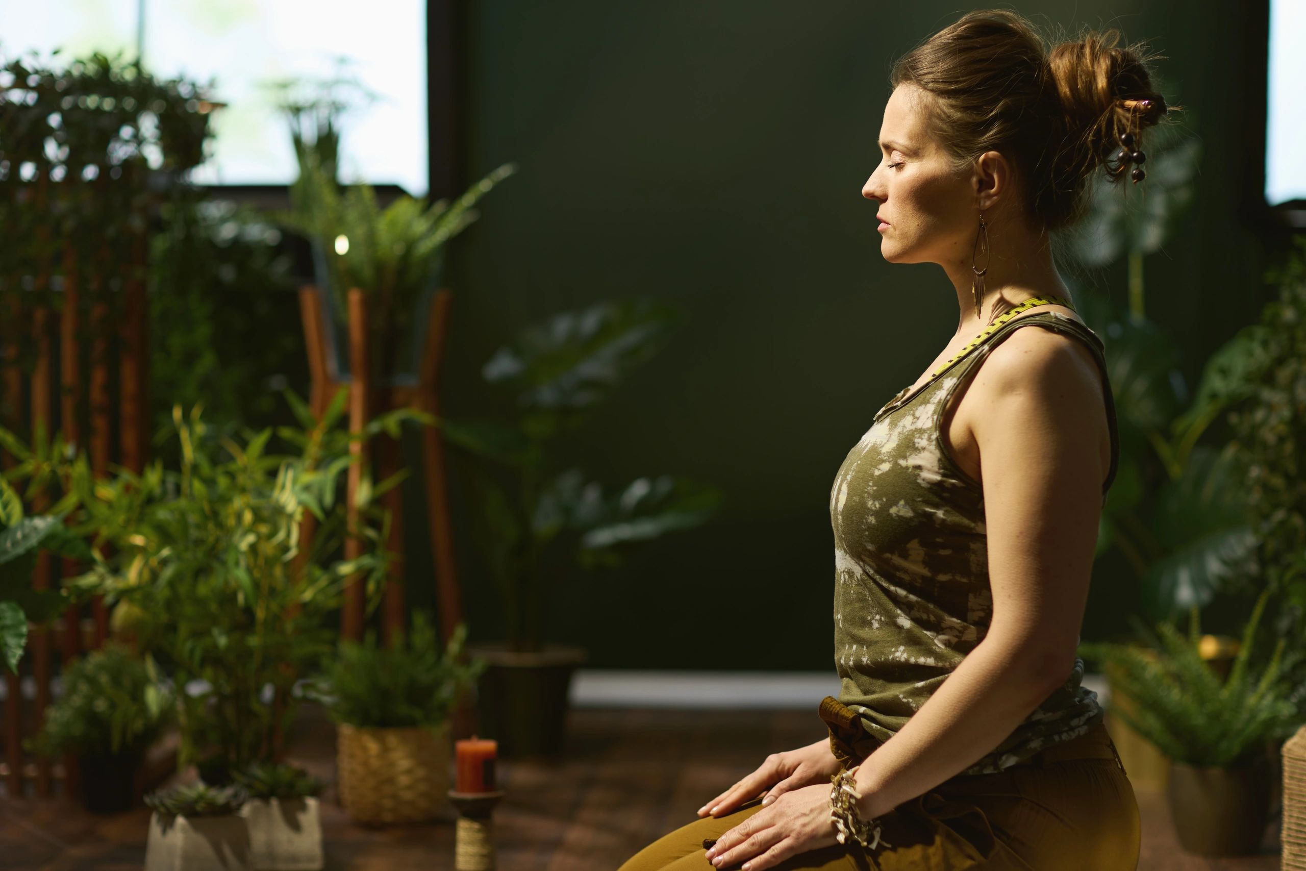 Woman in a calm green room practicing mindful movement
