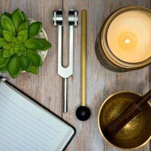 Mindfulness Ritual Flat Lay With Journal, Candle, Singing Bowl, and Tuning Fork