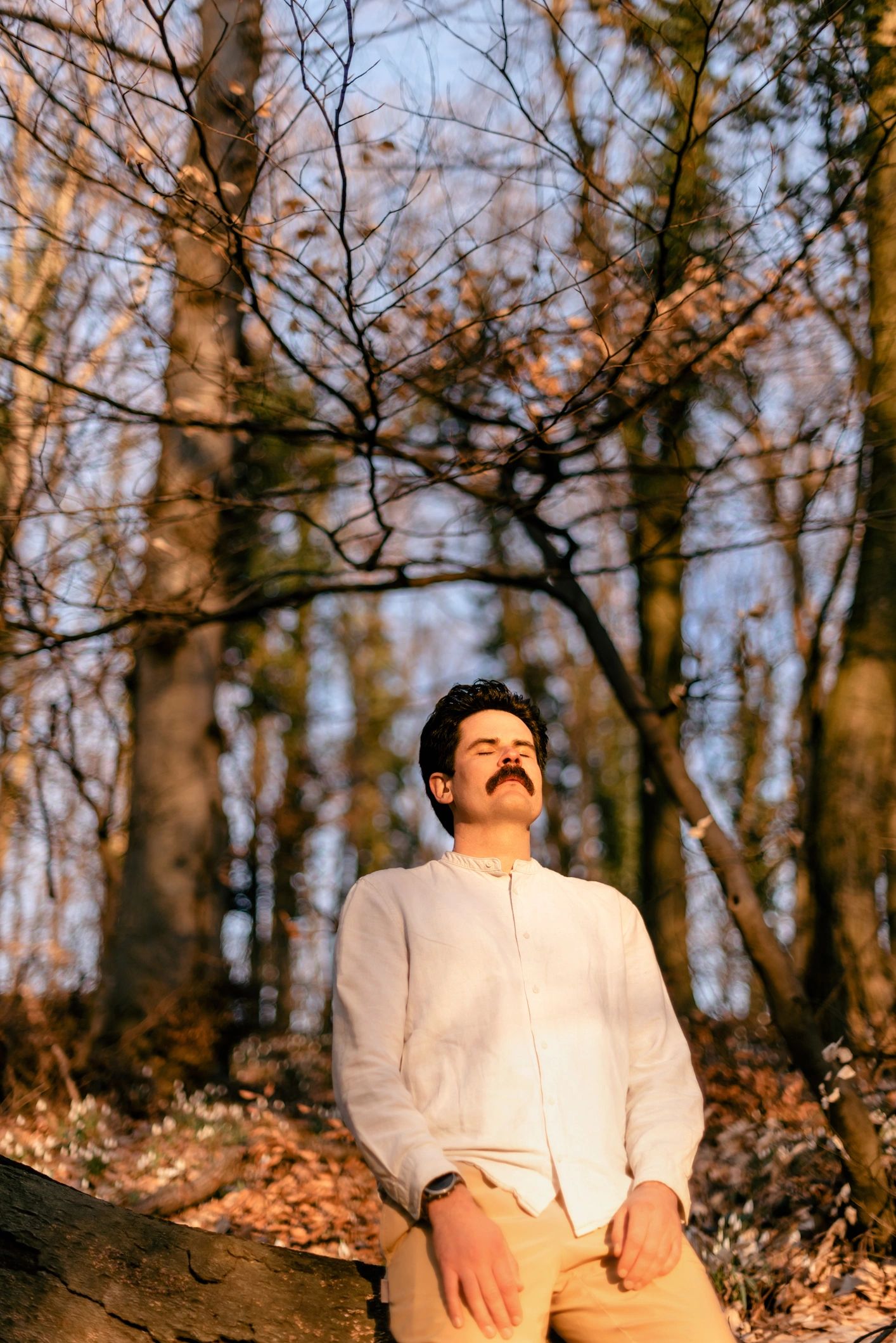 Calm therapist in a forest with eyes closed in mindfulness